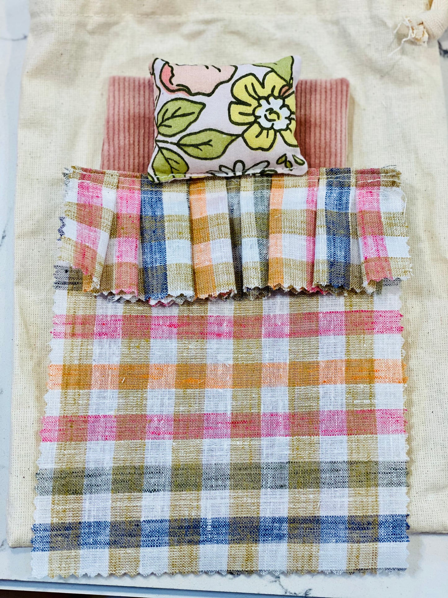 example of doll bedding, each will vary in colour and pattern